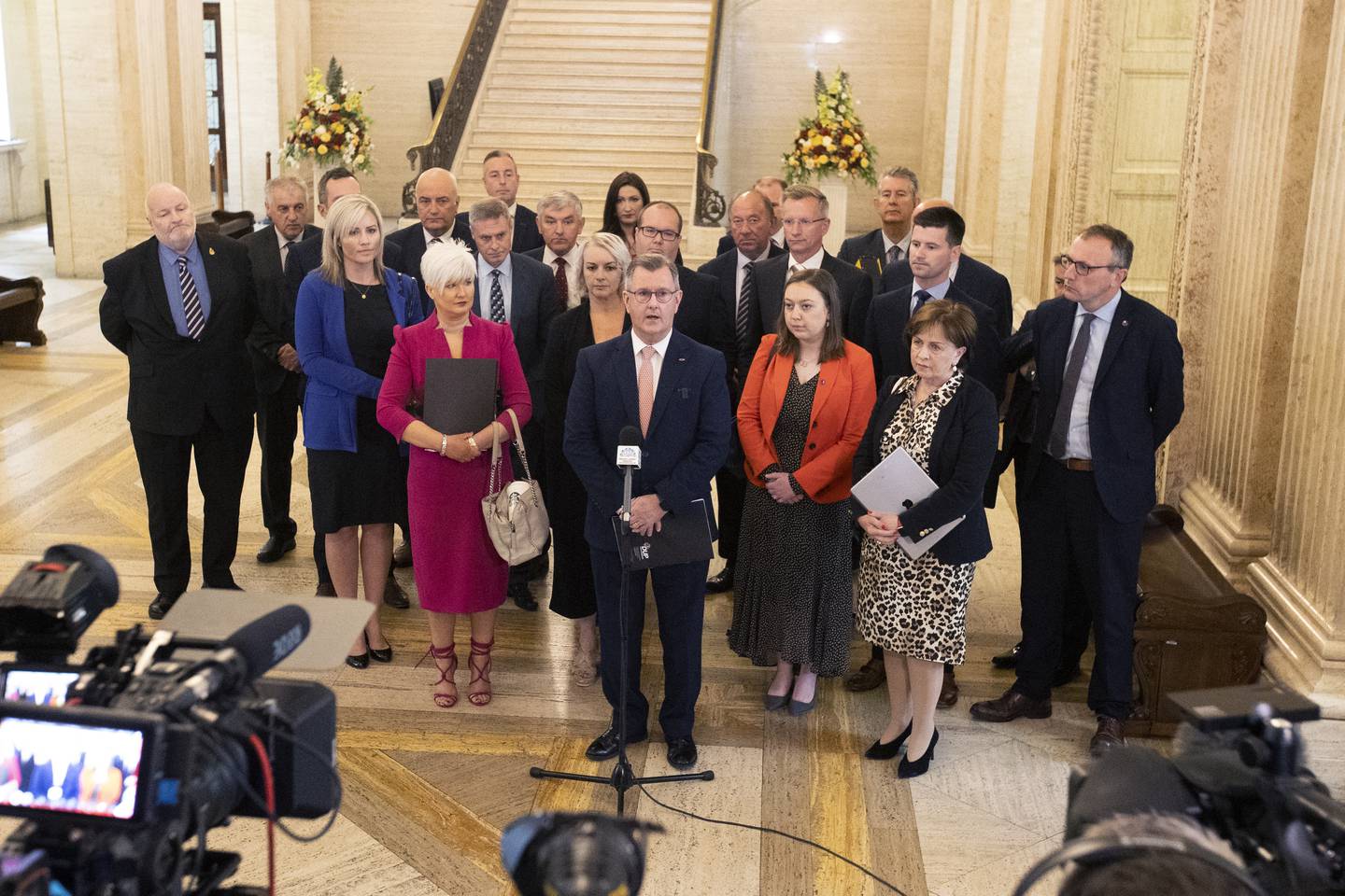 DUP Leader Sir Jeffrey Donaldson with party colleagues speaking in the Great Hall of Parliament Buildings at Stormont. PA