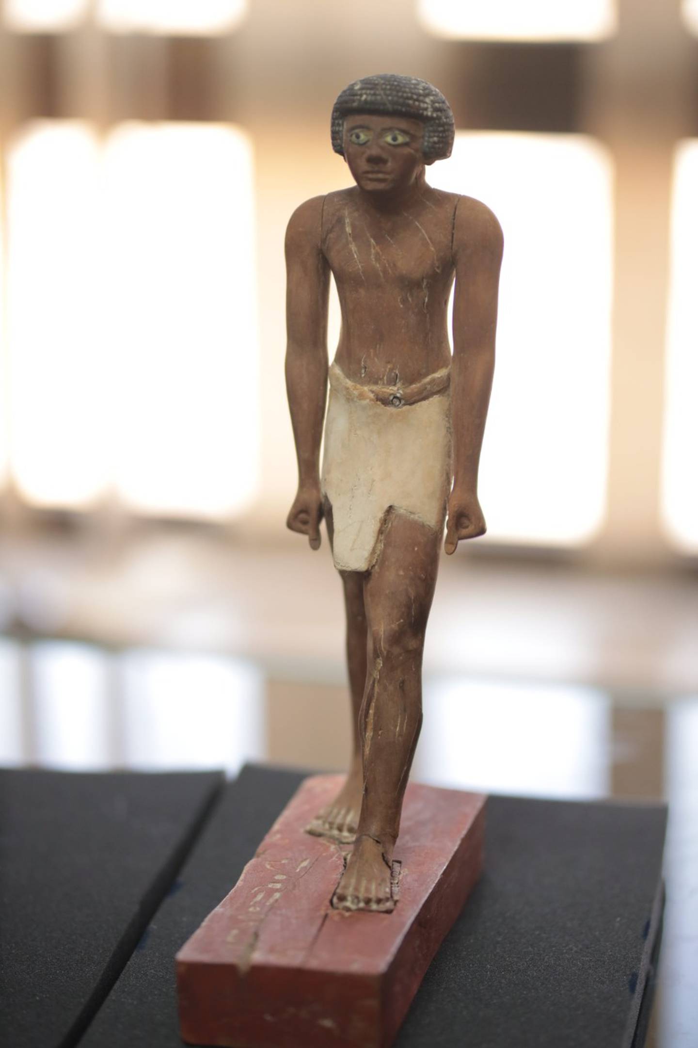 A painted wooden statue dating back to the Old Kingdom of ancient Egypt that was smuggled out o the country and recently returned by Belgium. Photo: Ministry of Tourism & Antiquities.