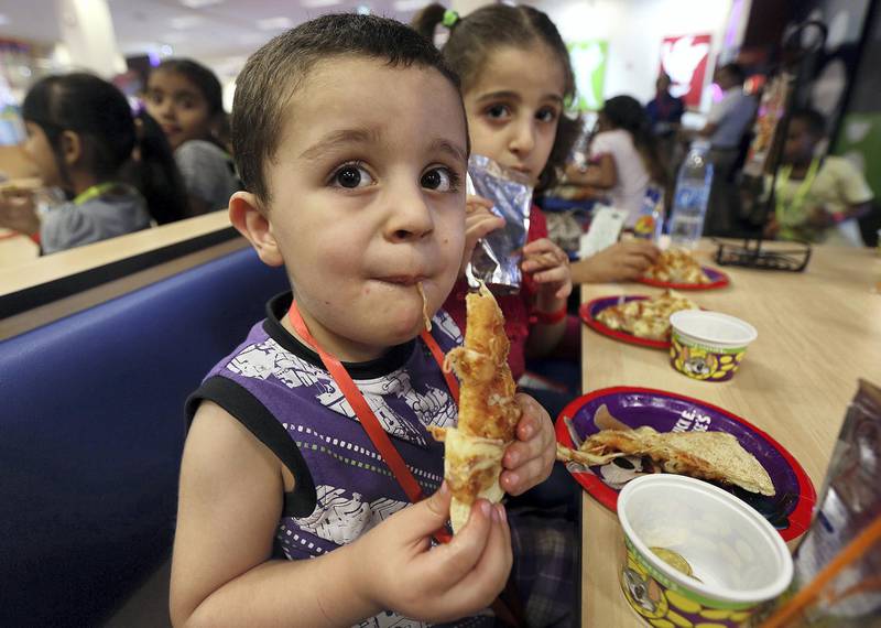 Dubai, June, 04, 2018: Orphan childrens enjoy the iftar hosted by Ibn Battutat Mall at the Chuck E Cheese restaurant at theI BN Battuta mall in Dubai. Satish Kumar for the National / Story by Patrick Ryan