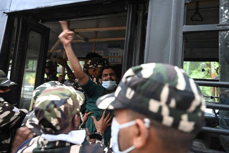 Police detain a student activist protesting against a government eviction drive in Assam that resulted in the deaths of two people. The demonstration was outside the Assam Bhawan in New Delhi on September 24, 2021. AFP