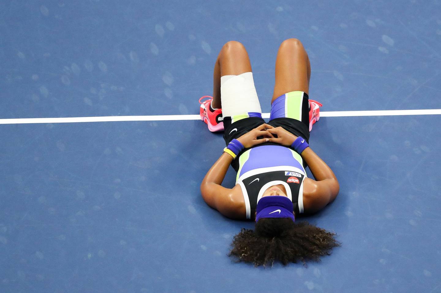 NEW YORK, NEW YORK - SEPTEMBER 12: Naomi Osaka of Japan lays down in celebration after winning her Women's Singles final match against Victoria Azarenka of Belarus on Day Thirteen of the 2020 US Open at the USTA Billie Jean King National Tennis Center on September 12, 2020 in the Queens borough of New York City.   Matthew Stockman/Getty Images/AFP
== FOR NEWSPAPERS, INTERNET, TELCOS & TELEVISION USE ONLY ==
