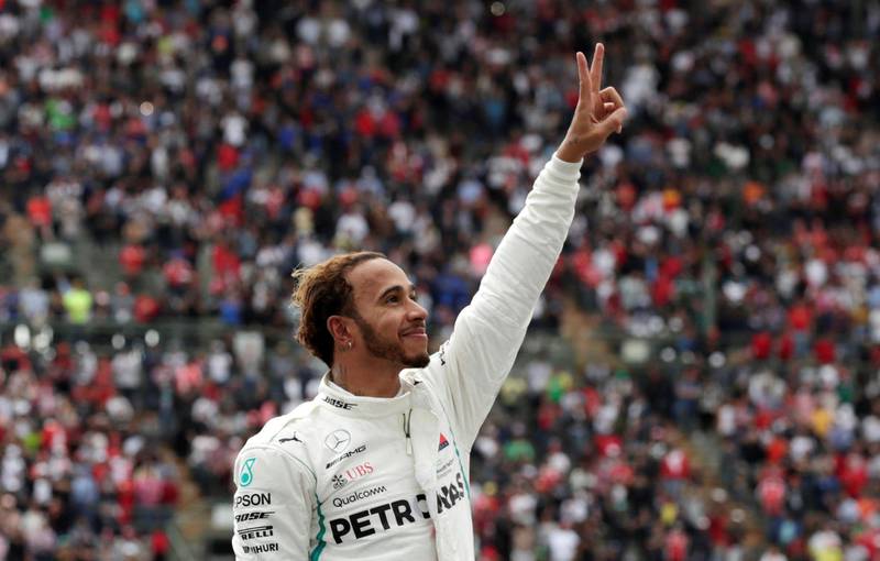 Lewis Hamilton celebrates after winning the World Championship. Reuters