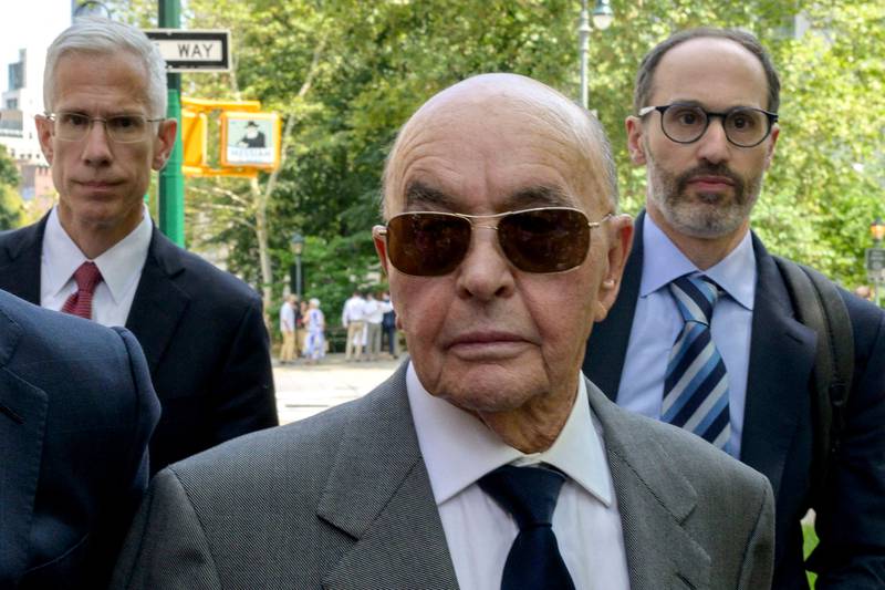 Tottenham Hotspur Football Club owner Joe Lewis (centre) leaves the Manhattan federal court after pleading not guilty to insider trading charges. AFP