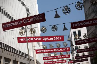 World Cup banners hang over the street in Doha. AFP