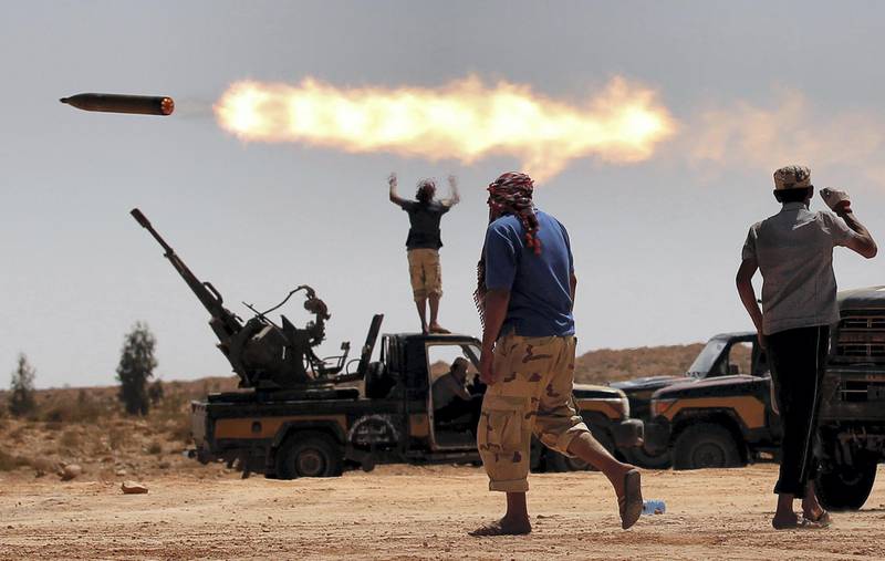 Anti-Gaddafi fighters fire a multiple rocket launcher near Sirte, previously one of Muammar Gaddafi's last remaining strongholds in Libya, September 24, 2011. Picture taken September 24, 2011. REUTERS/Goran Tomasevic/File Photo  SEARCH "POY DECADE" FOR THIS STORY. SEARCH "REUTERS POY" FOR ALL BEST OF 2019 PACKAGES. TPX IMAGES OF THE DAY.