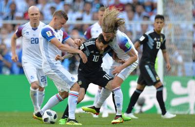 Argentina's Lionel Messi is putty under heavy pressure by the Iceland defense. Peter Powell / EPA