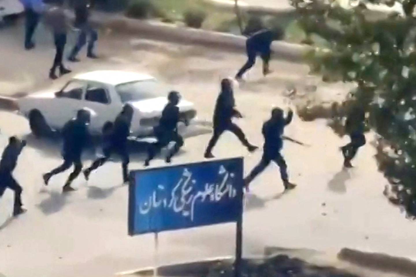 This image grab from a UGC video posted on October 29, 2022, reportedly shows security forces firing at buildings of the Kurdistan University Faculty of Medical Sciences in Sanandaj, the main city of Iran's Kurdistan province. Photo by various sources via AFP