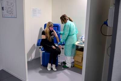 A Ukrainian refugee gets a Covid-19 vaccine at the Acea Hub in Italy's capital Rome. EPA