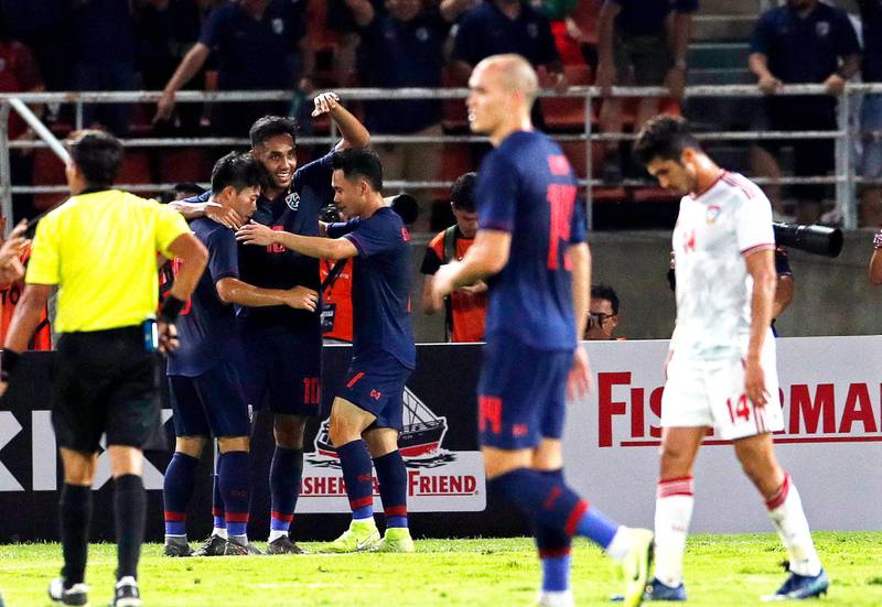 Thailand's Teerasil Dangda celebrates with teammates after scoring the opening goal. EPA