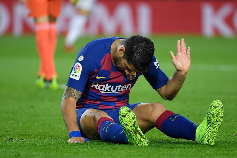 Barcelona's Uruguayan forward Luis Suarez reacts to missing a goal opportunity against Real Valladolid at the Camp Nou stadium in Barcelona on October 29, 2019. / AFP / LLUIS GENE