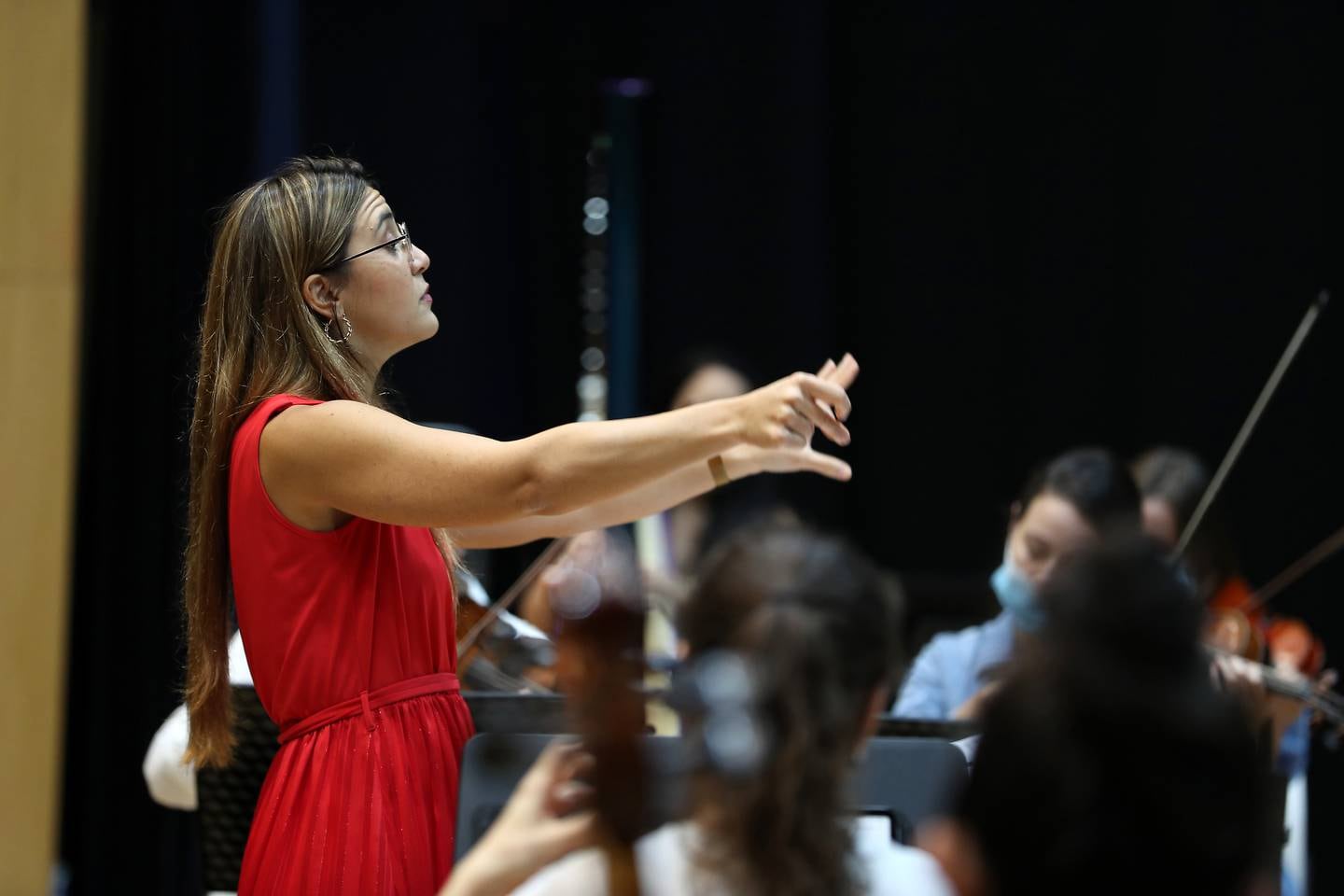 Yasmina Sabbah, conductor of the Firdaus Orchestra, during rehearsals in Dubai before performances at Expo 2020. Pawan Singh / The National. 
