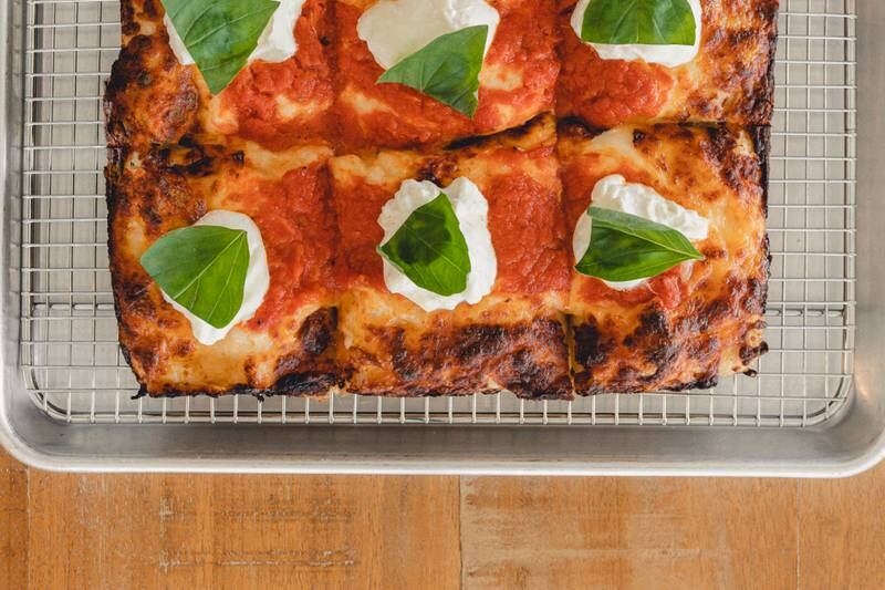 Emmy Squared Pizza serves its pies in a unique square shape. Photo: Cool Inc