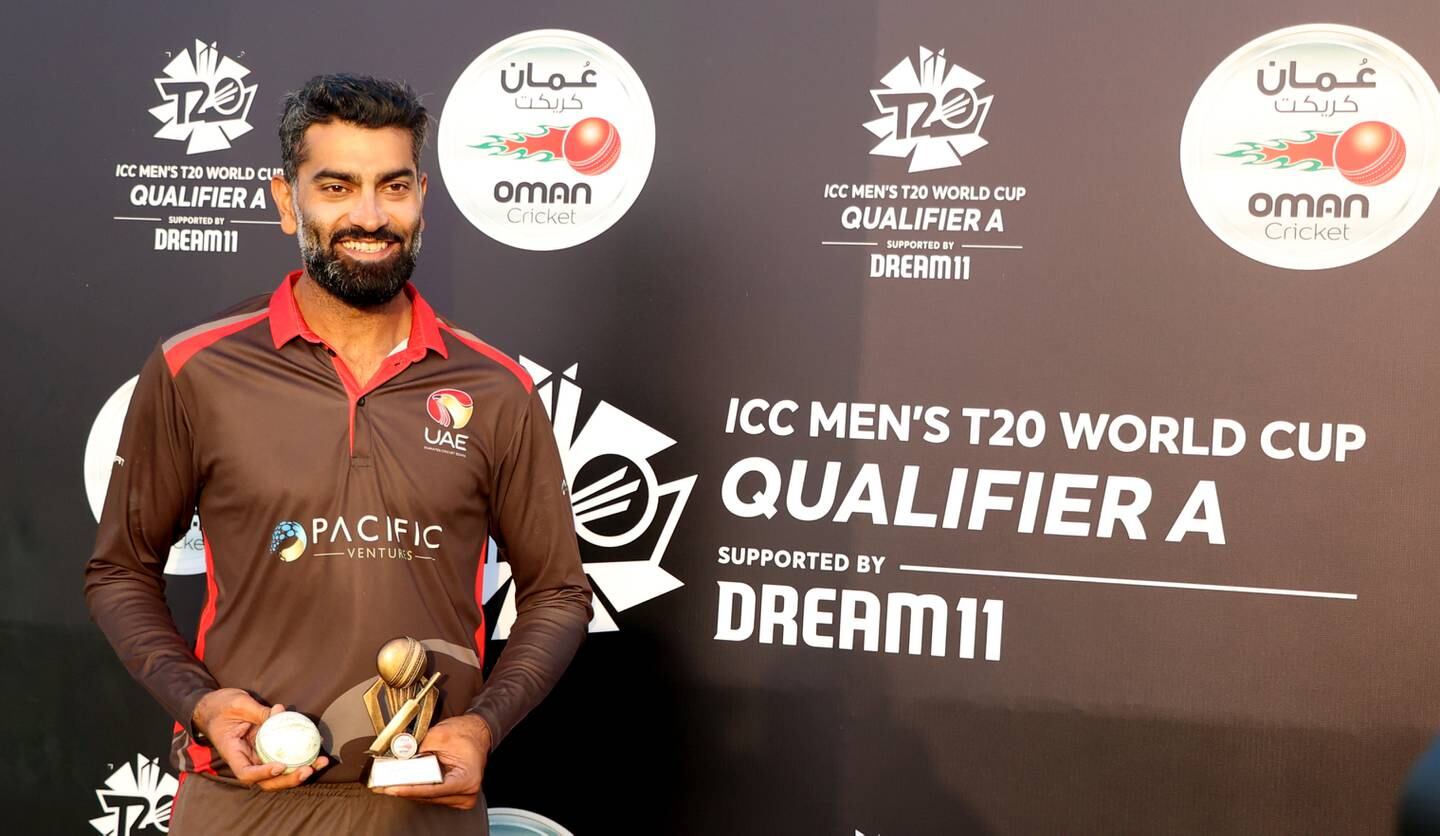 UAE's Ahmed Raza with his player-of-the-match award for his performance against Nepal. Subas Humagain for The National
