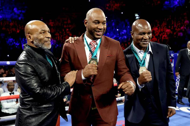 Former Heavyweight Champions Mike Tyson, Lennox Lewis and Evander Holyfield.