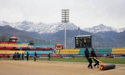 DHARAMSALA, INDIA - MARCH 24: Groundsmen prepare the pitch ahead of the Women's ICC World Twenty20 India 2016 match between England and the West Indies at the HPCA Stadium on March 24, 2016 in Dharamsala, India. (Photo by Matthew Lewis-ICC/ICC via Getty Images)
