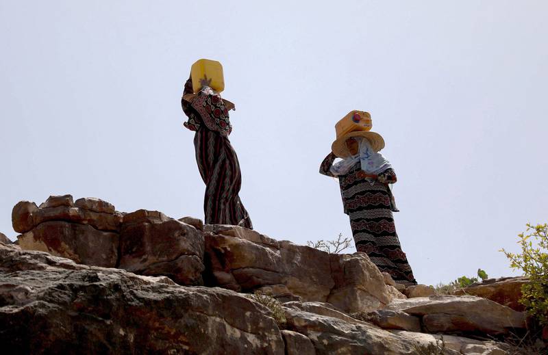Women carry water from a stream two kilometres from their homes at Bani Shaybah village, near Yemen's third city Taez. Yemen is one of the most water-stressed countries in the world. AFP