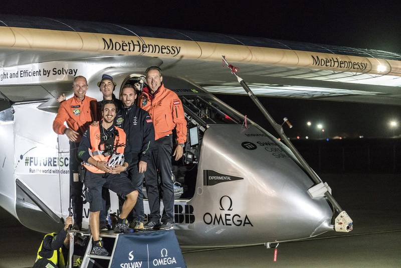 Swiss pilot Bertrand Piccard, left, and alternate pilot Andre Borschberg, right, pose with crew members in front of 'Solar Impulse 2' after landing at at Tulsa, Oklahoma, in the US, on May 13, 2016.