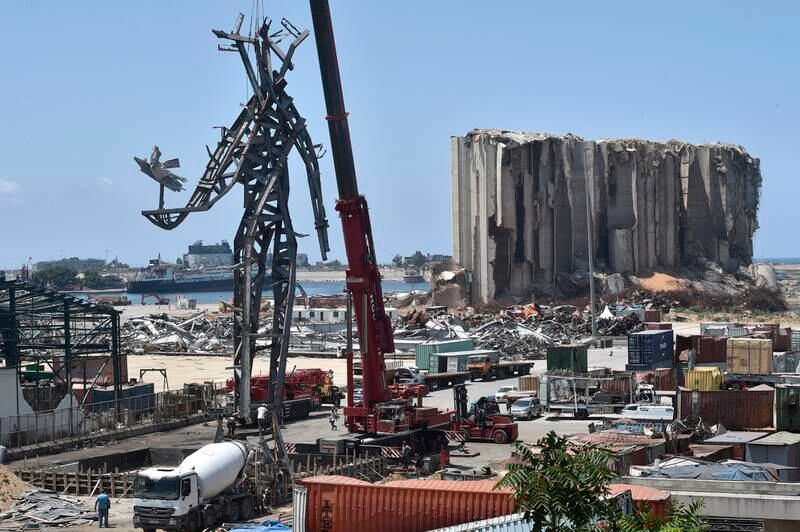 Workers install a monument inside Beirut port as a remembrance for the victims of the August 4 port blast in Beirut, Lebanon, July 27, 2021.  EPA