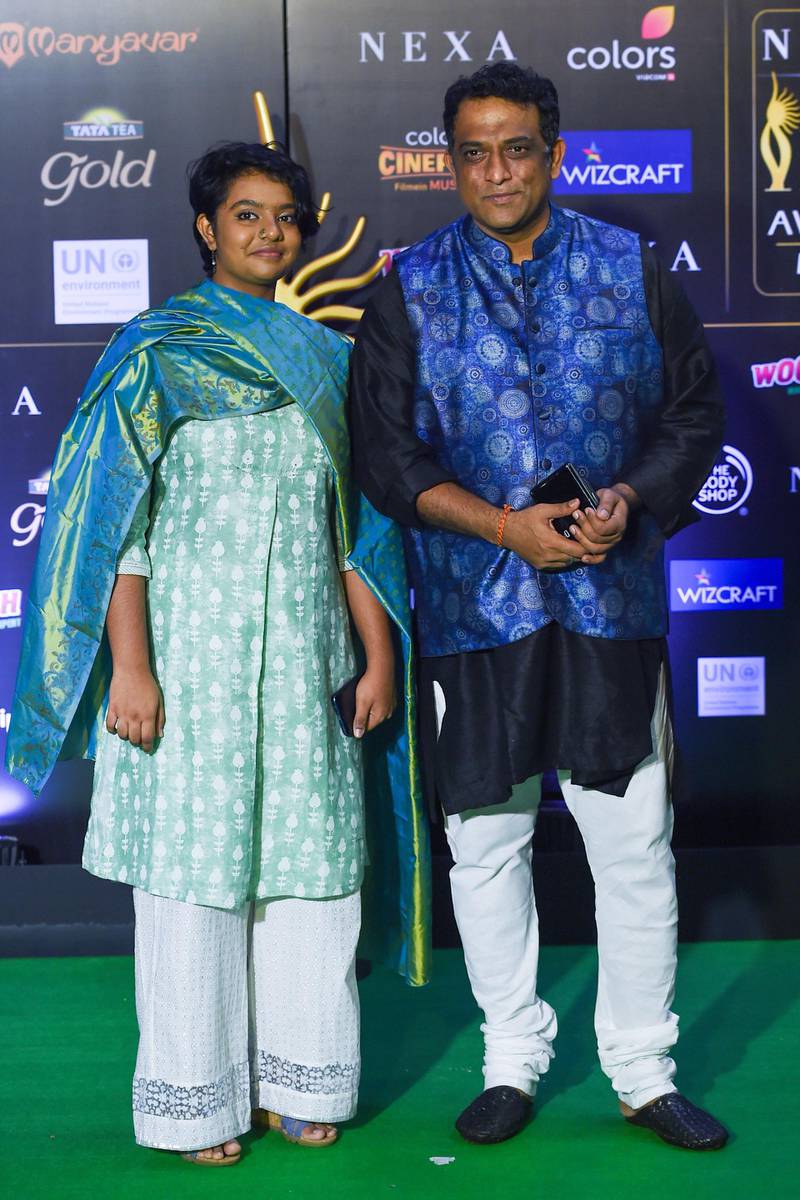 Bollywood director Anurag Basu (R) and guest arrive for the 20th International Indian Film Academy (IIFA) Awards at NSCI Dome in Mumbai on September 18, 2019. AFP