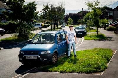 Nicholas Stone, 24, a student at Arts University Bournemouth, with his family's 1998 Mazda Demio at their home in Epsom, Surrey. 'Our family would have driven this car into the ground if it wasn't for the mayor's new Ulez expansion scheme but we're having to part with it as a lot of our daily amenities are inside the new boundary'