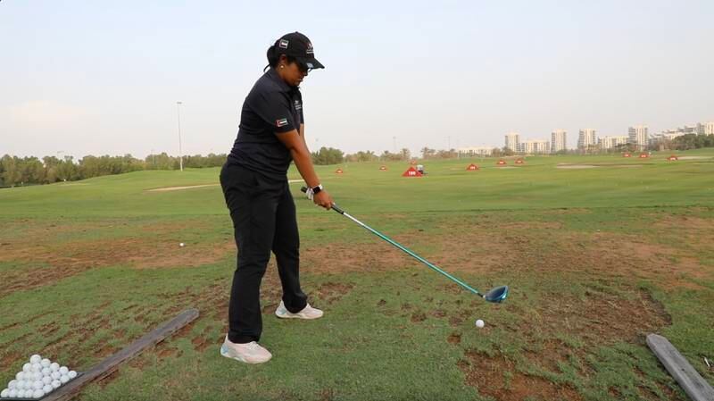 Alia Al Emadi, 18, on the practice range at Abu Dhabi Golf Club.

