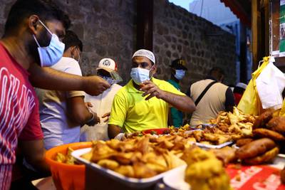 Customers buy delicacies hours before breaking their Ramadan fast in Dubai. Getty Images