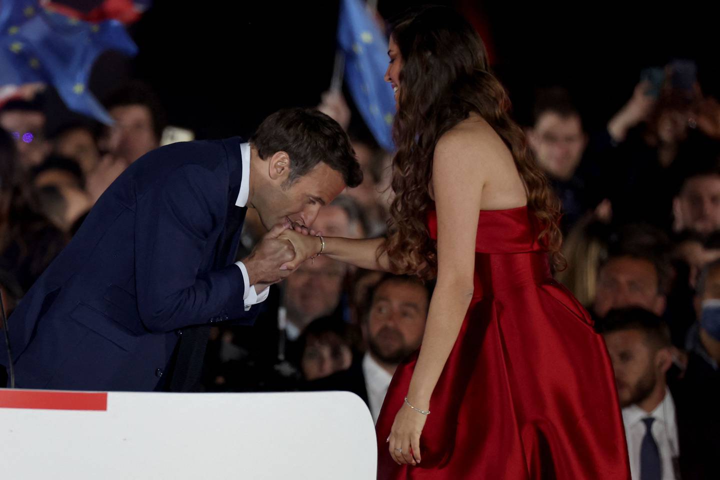 French President Emmanuel Macron greets Egyptian opera singer Farrah El Dibany following his victory in France's presidential election on Sunday. AFP