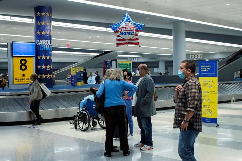 People meet relatives at baggage claim at John F Kennedy International Airport. Reuters