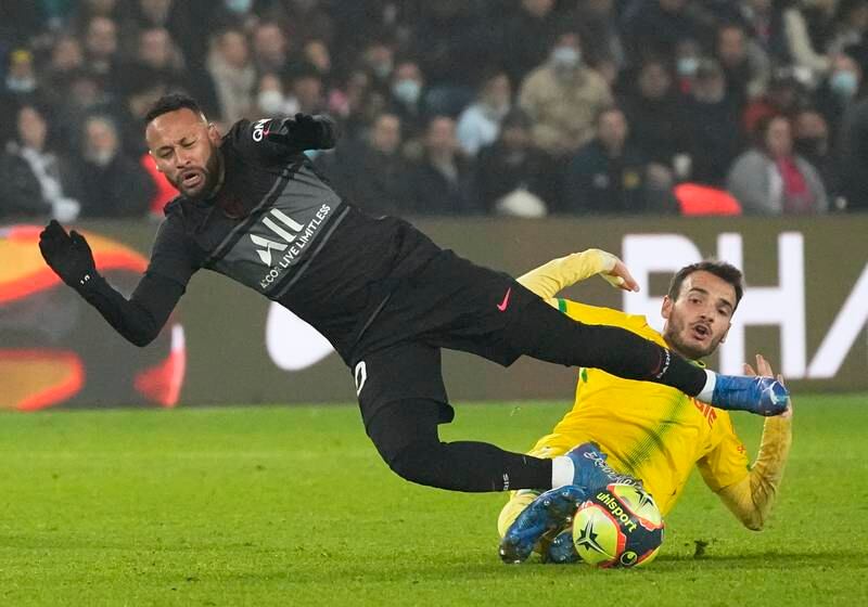 PSG's Neymar, left, and Nantes' Fabio challenge for the ball. AP