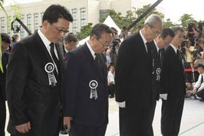 The North Korean delegation, among the chief delegate Kim Ki Nam, centre right, and the spy chief Kim Yang Gon, second from right, pay silent tribute at a service for Kim Dae-jung last week in Seoul, South Korea.