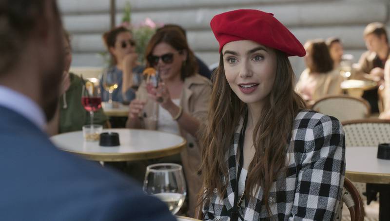 Lily Collins in a scene from the series Emily in Paris. Netflix via AP
