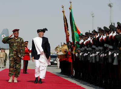 Afghan president Ashraf Ghani inspects the honor guard before the handover ceremony of Blackhawk helicopters from U.S. to the Afghan forces at the Kandahar Air base, Afghanistan October 7, 2017.REUTERS/Omar Sobhani