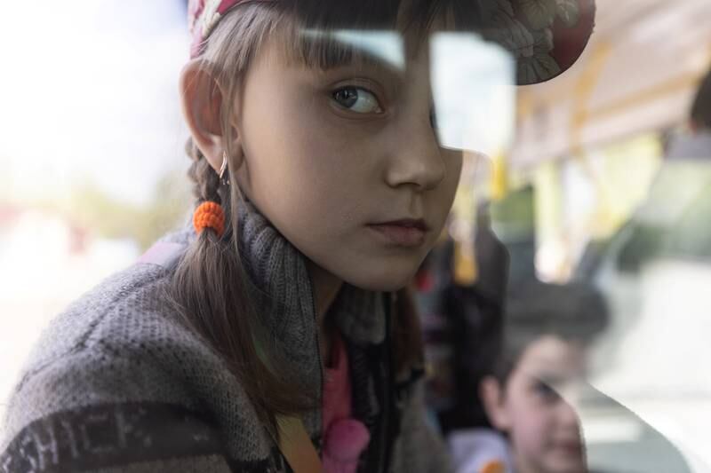A Ukrainian girl with other civilians on a bus as they flee the violence in Slovyansk, in the Donetsk region. Reuters