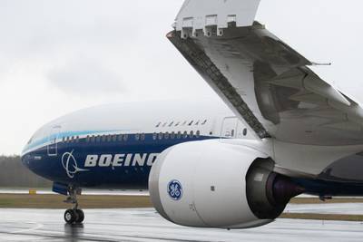 The folding wingtip of the Boeing 777X airplane is seen on the runway at the Paine Field airport in Mukilteo, Washington on  Friday, January 24, 2020. Bloomberg