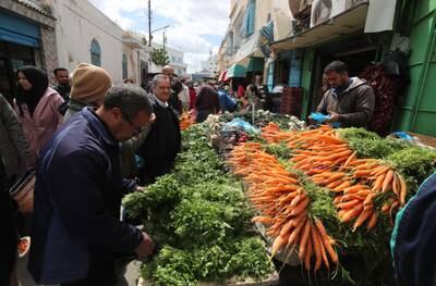 Tunisians buy fresh produce at a market on the first day of the Muslim fasting month of Ramadan in Tunis, on April 2.  EPA