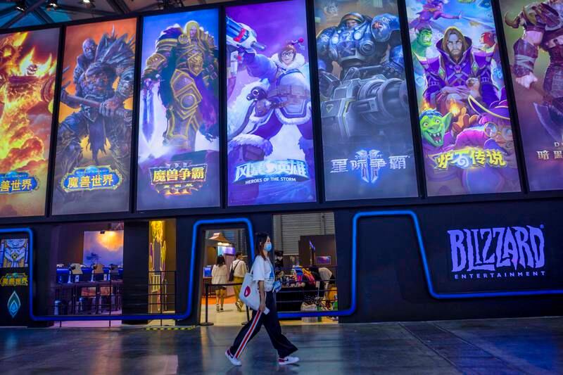 A woman passes by Blizzard booth in the ChinaJoy expo in Shanghai. EPA