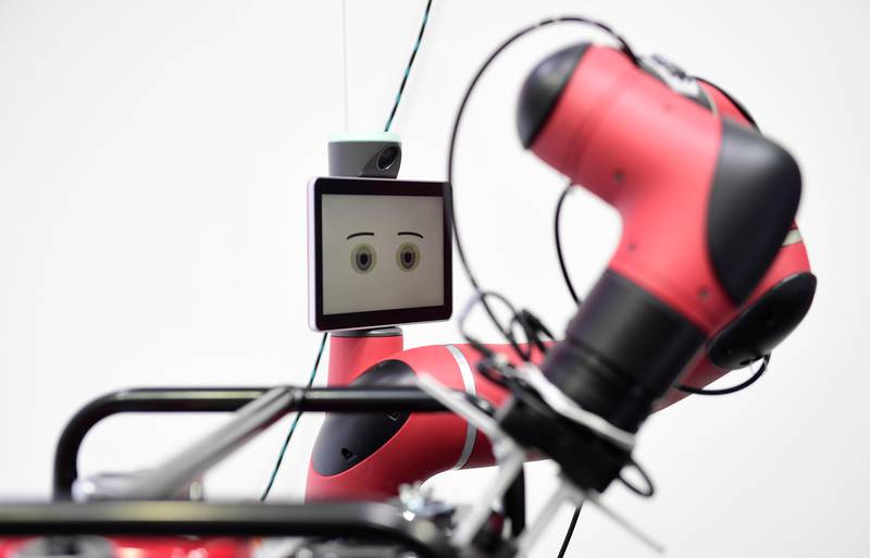 A robot performs at the booth of Rethink Robotics at the Hanover Fair ('Hannover Messe') in Hanover, northern Germany, on April 24, 2017.Poland is this year's partner country of the fair running until April 28, 2017. / AFP PHOTO / TOBIAS SCHWARZ
