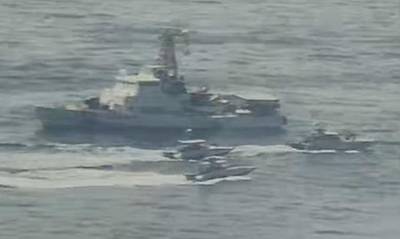 Iranian Islamic Revolutionary Guard Corps Navy (IRGCN) vessels near US Military ships at close range. EPA