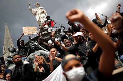 People attend a protest against police brutality and the death in Minneapolis police custody of George Floyd, in Nantes, France, June 8, 2020. REUTERS/Stephane Mahe TPX IMAGES OF THE DAY - RC235H9VE8PJ
