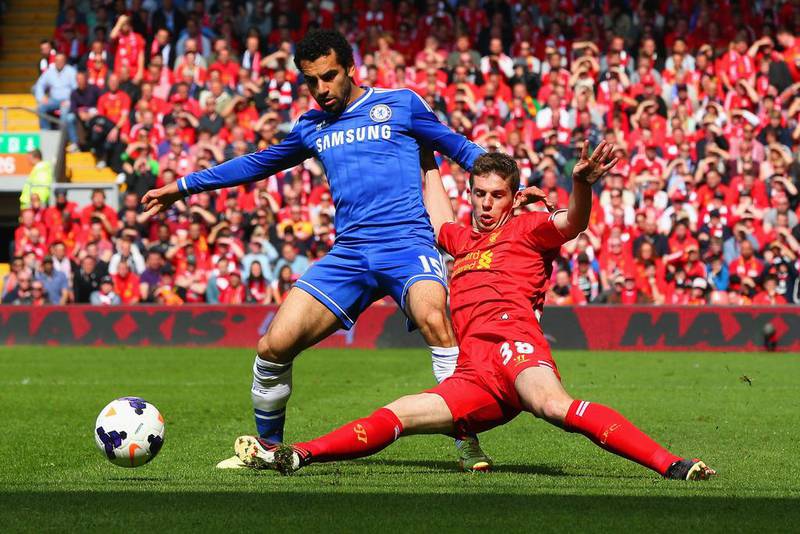 Mohamed Salah, left, of Chelsea is tackled by Jon Flanagan of Liverpool during their Premier League match at Anfield on April 27, 2014, in Liverpool, England. Clive Brunskill / Getty Images