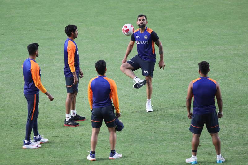 Virat Kohli playing football with India teammates during training on March 8. AP