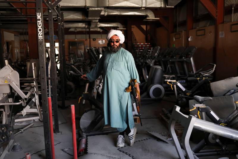 Vahdat, a Taliban soldier and former prisoner, stands next to exercise equipment in Bagram Air Base. Reuters