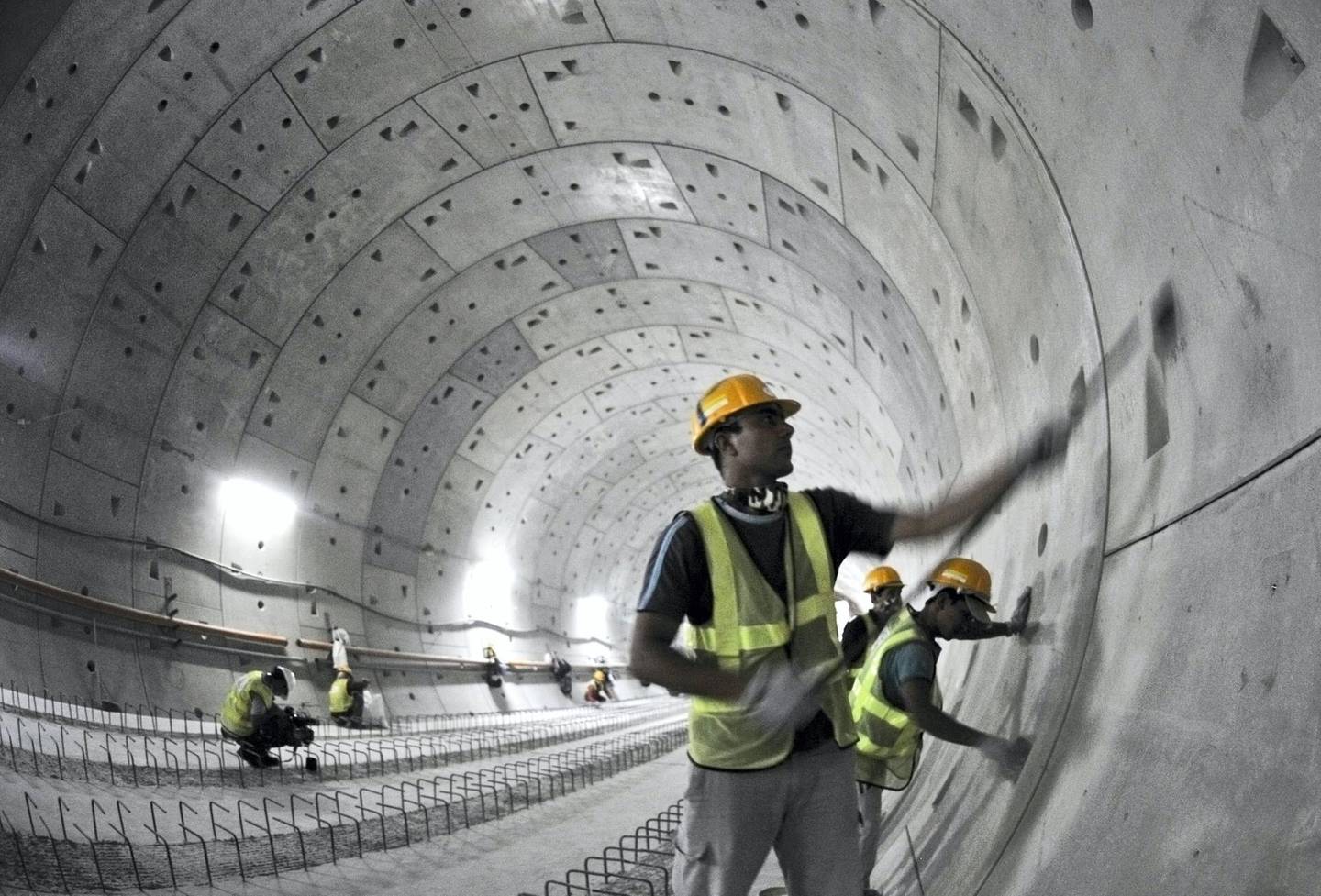 Labourers work in the underground tunnel of Union Square Station, one of two underground stations where both lines meet at Metro Dubai, currently under construction, May 28, 2008. The driverless and fully automated metro network is scheduled for completion in 2009, and will be the longest fully automated rail system in the world, consisting of 47 stations in total, ten of which will be underground. REUTERS/Jumana El Heloueh (UNITED ARAB EMIRATES)