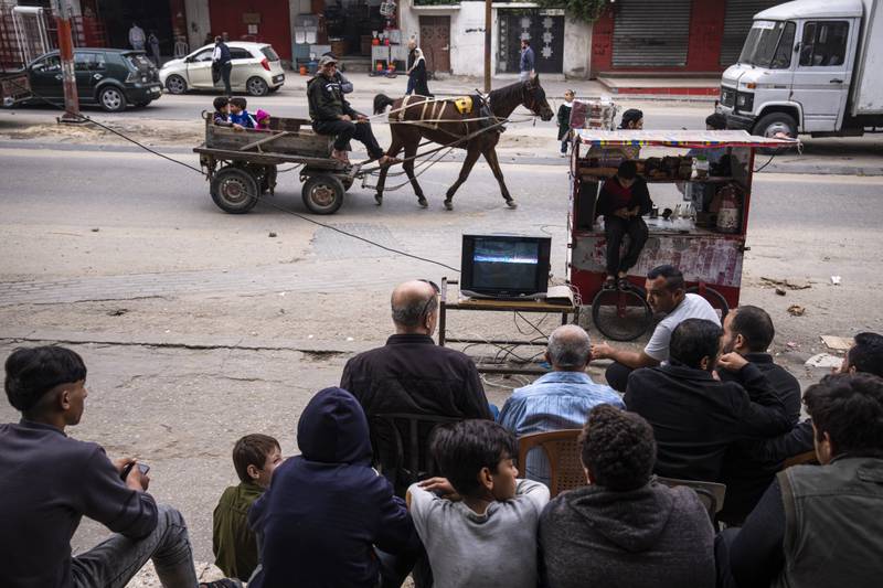 Palestinians on the streets of Gaza City watch a live broadcast of South Korea v Ghana. AP Photo
