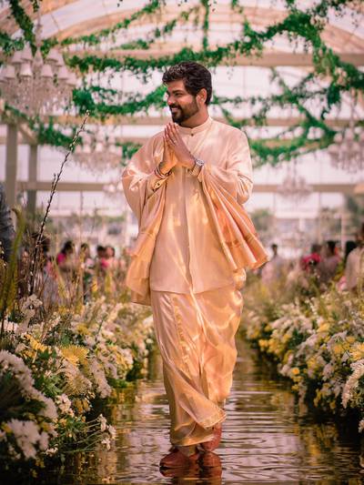 Shivan wore a veshti, a sarong-like robe wrapped around his waist, paired with a kurta and shawl, handcrafted by Jade.