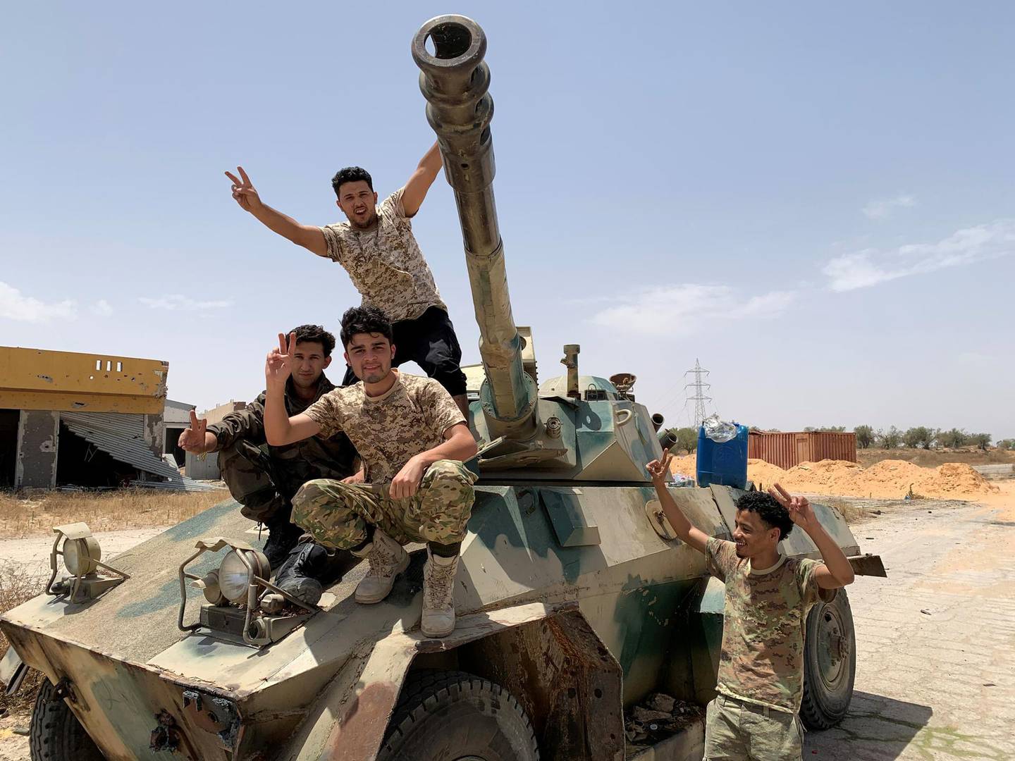 FILE PHOTO: Fighters loyal to Libya's internationally recognised government celebrate after regaining control over the city, in Tripoli, Libya, June 4, 2020. REUTERS/STAFF/File Photo