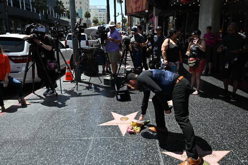 Fans paid tribute to Newton-John by placing photographs and flowers at her star in Hollywood's Walk of Fame. AFP