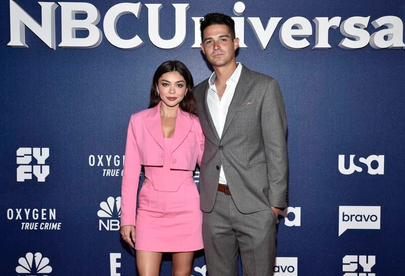 Sarah Hyland, left, and Wells Adams married in an outdoor ceremony in California on August 20. Invision / AP