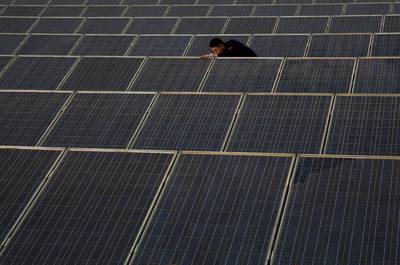 At present the piloted website features six products including a solar photovoltaic (PV) rooftop kit costing from Dh15,200 to just under Dh160,000. Kevin Frayer / Getty Images