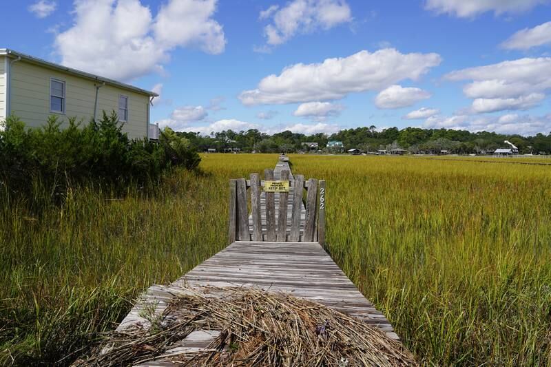 Debris caused by Hurricane Ian is strewn on a dock on Pawleys Island, South Carolina. Willy Lowry / The National